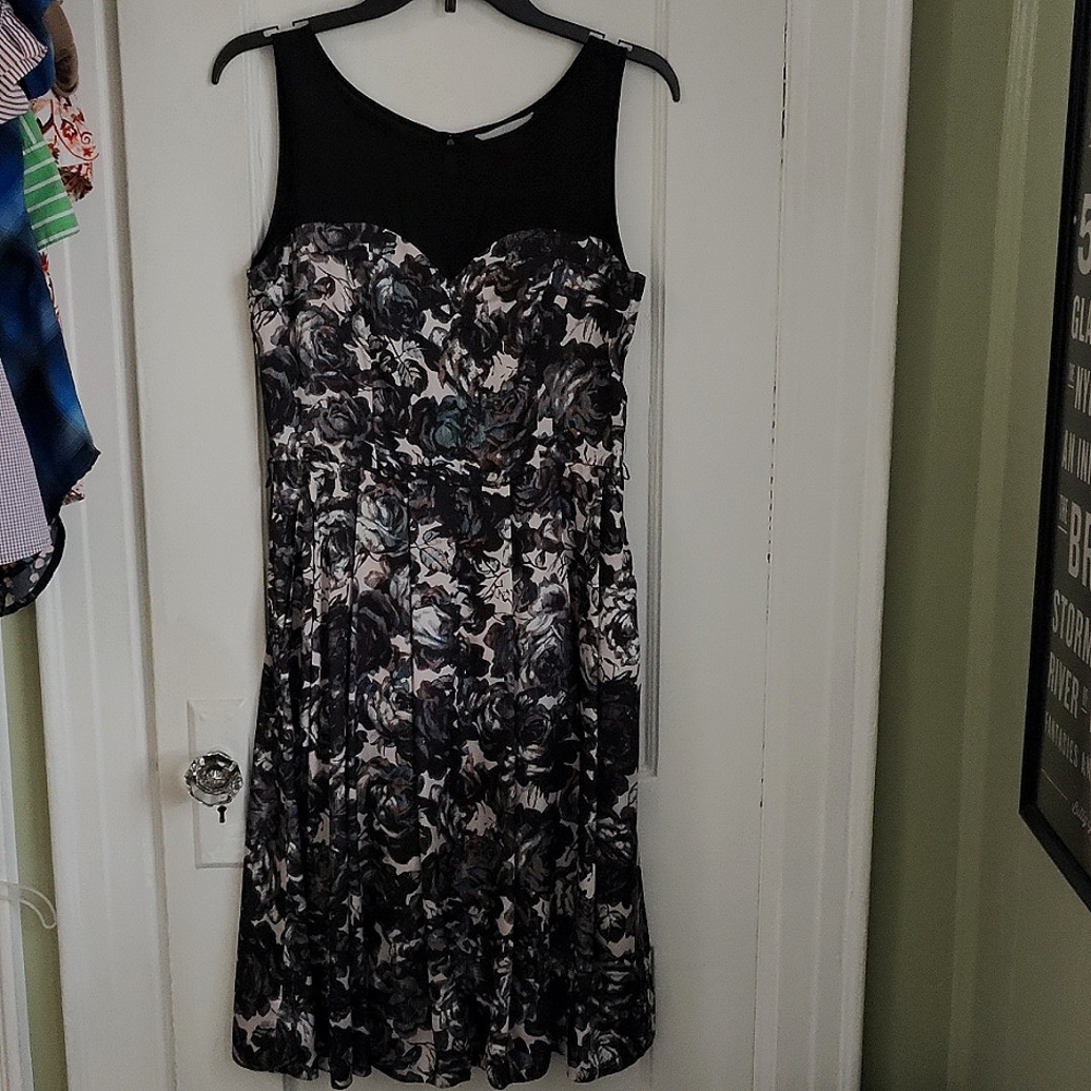 Dress with black white and cream roses. Pockets!